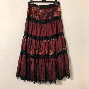 Red tiered skirt with lace and embroidery detailing